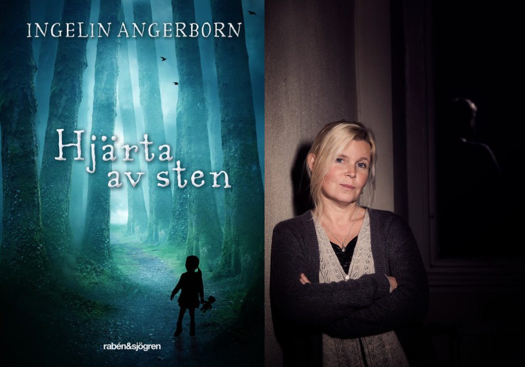 Författaren Ingelin Angerborn står bredvid sin bok "hjärta av sten"